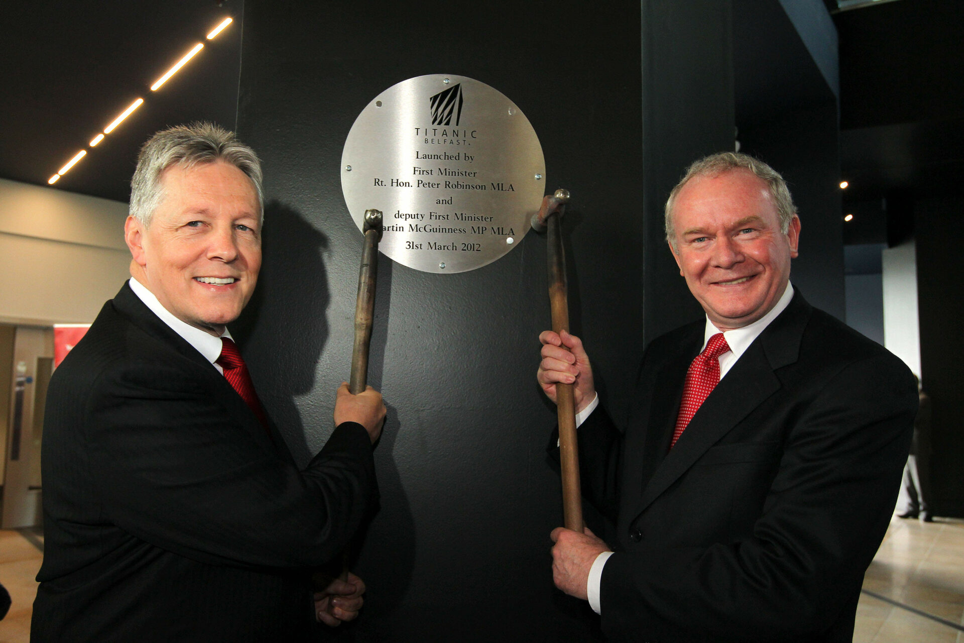 Press Eye - Belfast - Northern Ireland 

Northern Ireland's First Minister, Peter Robinson (left) and deputy First Minister, Martin McGuinness, unveil a plaque to open Titanic Belfast, the world's largest Titanic visitor attraction, located on the site where Titanic was built. 
Mandatory credit: Picture by Brian Thompson/ Presseye.com