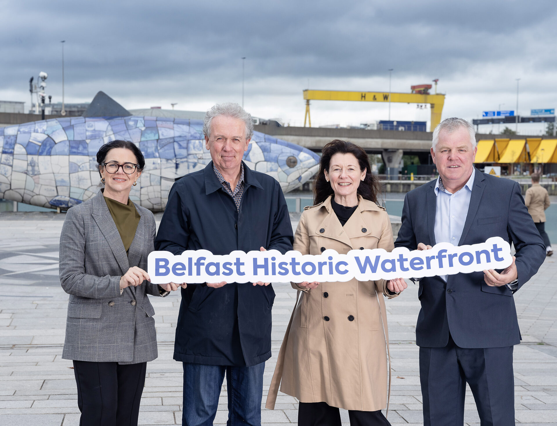Belfast Historic Waterfront has been chosen by The National Lottery Heritage Fund as one of six new places to benefit from a multi-million-pound UK-wide investment in Heritage Places aimed at unlocking heritage potential. Maritime Belfast Trust will lead on the project. Pictured at the announcement are Michele Bryans, Chief Executive, EastSide Partnership, Dr Paul Mullan, NI Director, The National Lottery Heritage Fund, Kerrie Sweeney MBE, Chief Executive, Maritime Belfast Trust and Gerard Rice, Director of Service LORAG (Lower Ormeau Residents Action Group).